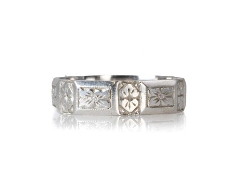 A platinum band, with rectangular hand engraved floral panels, stamped Plat, tested as platinum, 6.87gRing size S½