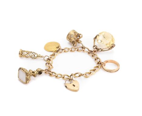 A 9ct gold charm bracelet, each link stamped 9.375, to a heart padlock, London 1961, suspending six charms, comprising a pier