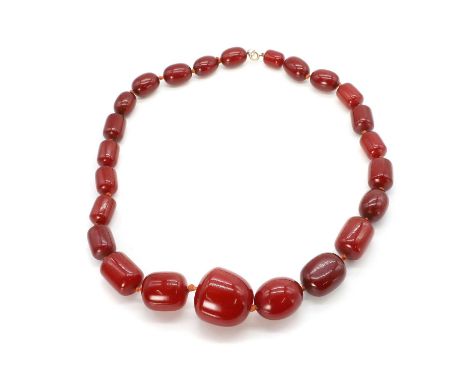 A single row Bakelite bead necklace, with graduating oval and barrel shaped beads, with swirls, 13mm to 33mm in size, strung 