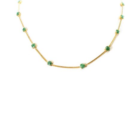 A jade necklace, set with sixteen round cut jades, each in a four claw setting, alternating to lengths of flat curb link chai