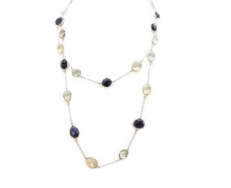 A sapphire and vari coloured quartz long necklace, with alternating checkerboard cut sapphires and pale yellow to green quart