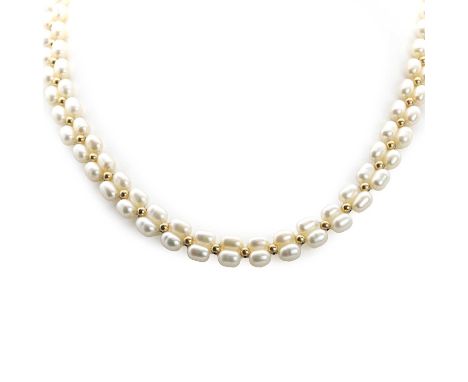 A cultured freshwater pearl and gold bead necklace, with rice shaped cultured freshwater pearls, approximately 6.50mm in size