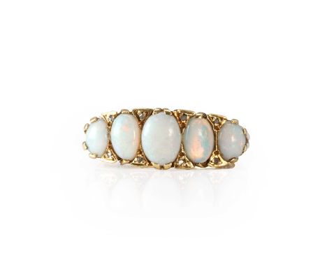 A 9ct gold opal and diamond ring,  with five graduated oval opals, all claw set and alternating to small rose cut diamonds gr