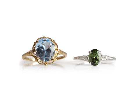 Two gemstone set single stone rings, a white gold tourmaline single stone ring, with an oval cut tourmaline, 7mm x 5mm, flank