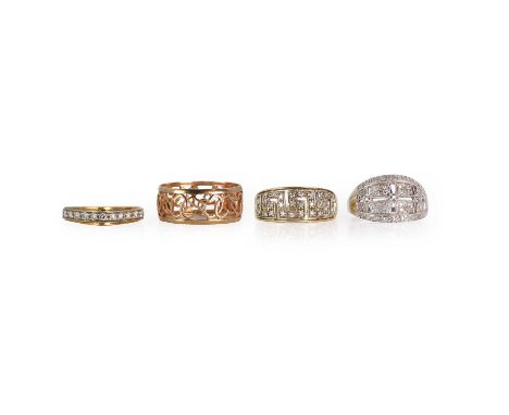 A group of four gold rings, comprising:a diamond half eternity ring,a raised white bar set with round brilliant cut diamonds,