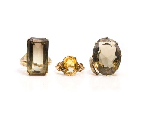 A group of three single gemstone rings, a 9ct gold citrine single stone ring,with floral shoulders and a D section shank, Lon