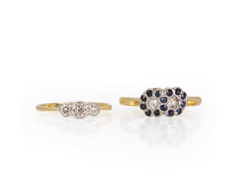 An Edwardian double cluster ring and another, a double flower-head cluster with sapphires and old cut diamonds collet set whi