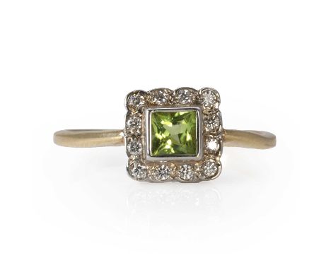 A peridot and diamond cluster ring,  a square cut peridot, to a surround of round brilliant cut diamonds, bezel and grain set