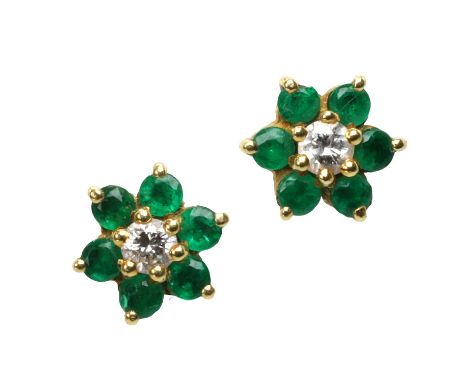 A pair of 18ct gold emerald and diamond earrings, retailed by Asprey, each cluster with a central round brilliant cut diamond