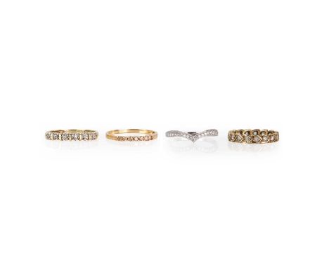 A group of 9ct gold rings, comprising:a 9ct white gold cubic zirconia wishbone ring,London hallmark,  a 9ct gold synthetic sp