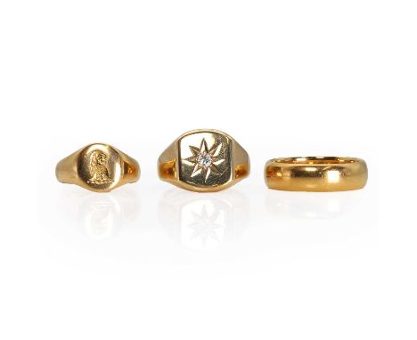 A group of three gold rings, an 18ct gold signet crest ring, with an engraved dragon head, to a court profile band, London 19