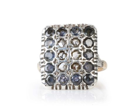 A diamond and sapphire panel ring,  a rectangular silver panel with rose cut diamonds and round cut sapphires, all bead set, 