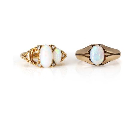 A Victorian opal and diamond ring and an Edwardian opal ring, a three stone opal and diamond ring, with oval cabochon opals, 