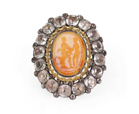 A silver mounted black dot paste and carnelian intaglio brooch,  with a neoclassical carnelian intaglio encircled by a yellow