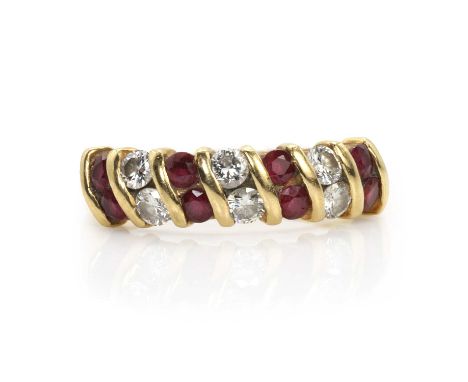 An 18ct gold ruby and diamond ring,  with a double row of alternating round cut rubies and round cut brilliant diamonds, all 