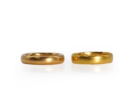 Two 22ct gold wedding rings, a 22ct gold wedding ring, with a court profile, London 1913,and a 22ct gold wedding ring, with a