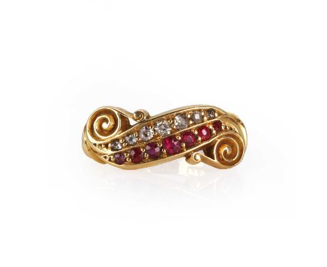 An Edwardian 18ct gold ruby and diamond ring,  with a graduated row of round cut rubies alongside a row of eight cut diamonds