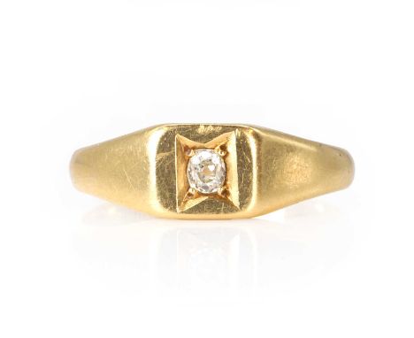 An18ct gold diamond signet ring,  a rectangular head, with a small old cut diamond recessed and grain set, into tapered shoul