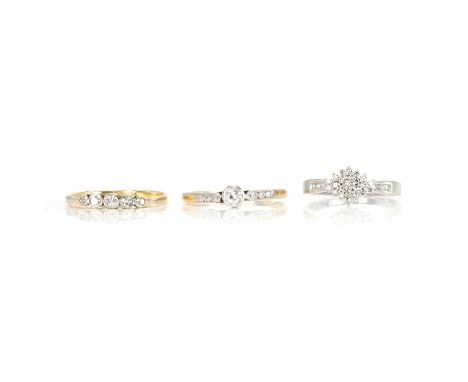 A group of three diamond set rings, a five stone diamond ring, rub set with five graduated old single cut diamonds, stamped '