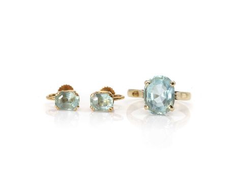 An aquamarine ring and earring set, the ring with an oval cut aquamarine, 11.5mm x 9mm, claw set to a D profile shank, and a 