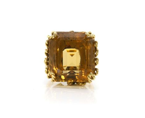 A citrine single stone ring,  a rectangular cut citrine, 19mm x 20mm, claw set to a wire twist basket, to open shoulders and 