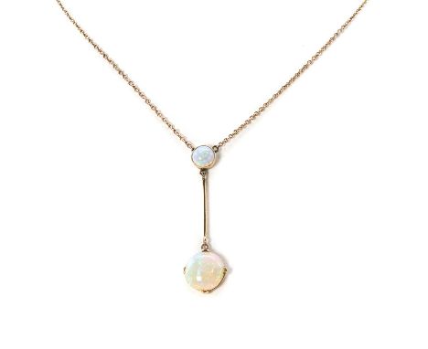 An early 20th century Edna May style drop necklace, a circular cut opal cabochon, 12mm diameter, to a smaller circular cut op