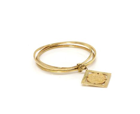 A sovereign coin bracelet, composed of three 18ct gold hollow bangles, each with reeded edges, round in shape and with a squa