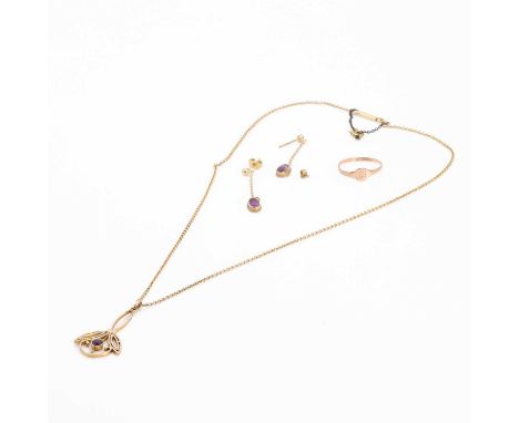 A small group of jewellery, comprising an Edwardian amethyst pendant, with a round cut amethyst rub set to the centre of a fl