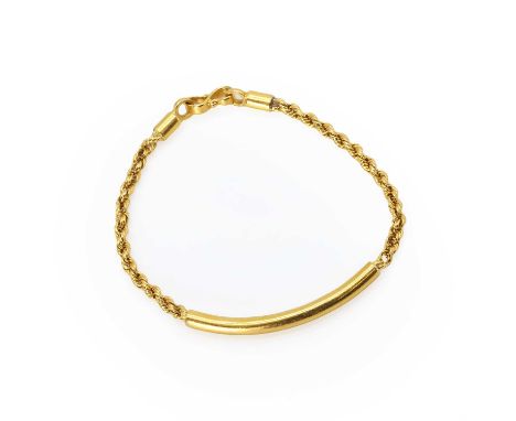 A gold 'ID' bar bracelet, a hollow curved bar, with a rope twist chain to either side, into an S-shaped clasp, 175mm long, be