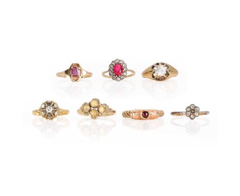 A group of gemstone set rings, a diamond single stone ring, stamped 18ct, a paste cluster ring, stamped 18ct, both tested as 