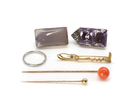 A group of precious metal and costume jewellery, a platinum wedding ring, stamped platinum, an equestrian riding crop brooch,