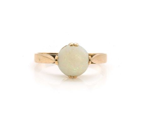 An Edwardian opal ring,  a round opal cabochon, double claw set to tapered shoulders and a flat section shank, stamped 18CT, 