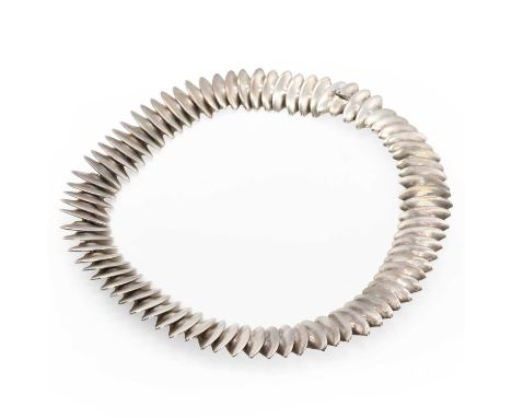 A sterling silver necklace, by Hans Hansen for Georg Jensen, composed of a series of curved triangular panels all joined by j