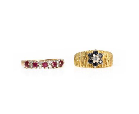 Two gold gemstone set rings, a sapphire and diamond daisy cluster ring,with a round brilliant cut diamond, to a surround of r