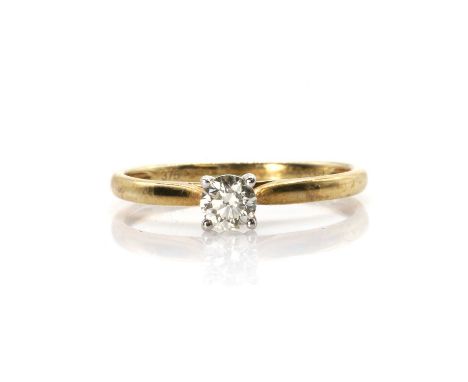 A 9ct gold single stone diamond ring  with a round brilliant cut diamond, claw set in white, to a yellow underbezel, hollow s