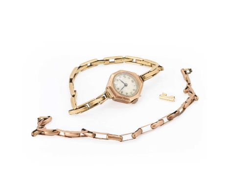 A ladies' 9ct gold mechanical bracelet watch, with a hexagonal case, 21mm x 23mm, a silvered dial, blued lozenge hands, Londo