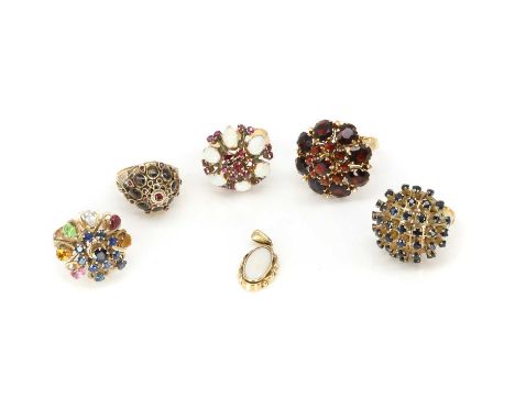 A group of four Thai princess rings, comprising a ruby and star sapphire Thai princess ring, a sapphire and opal Thai princes