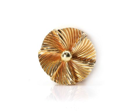 A floral swirl brooch,  the stylised flowerhead, with a circular undulating twist design, to a double sprung pin with a rolle