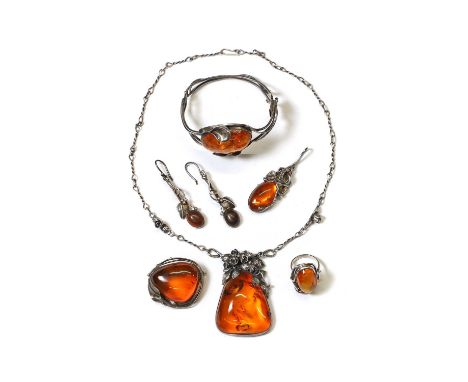 A group of silver and amber jewellery, comprising a clarified amber floral pendant, 57mm long, with floral links and a wire t