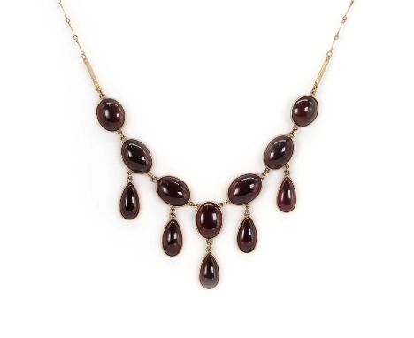 A cabochon garnet fringe necklace, with oval and pear-shaped cabochon garnets, spectacle set, on a fine chain, the clasp stam