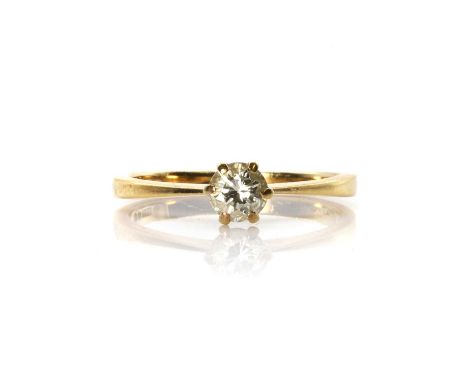 An 18ct gold single stone diamond ring,  with a central round brilliant cut diamond, approximately 0.30ct, claw set to tapere