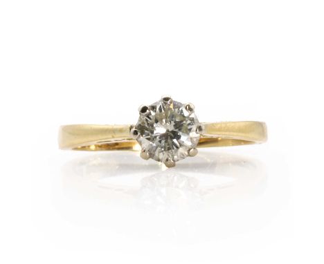 An 18ct gold single stone diamond ring,  set with a round brilliant cut diamond, estimated as approximately 0.30ct, in an eig