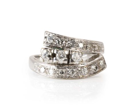 A diamond crossover design ring,  with three round brilliant cut diamonds claw set to the centre, to crossover shoulders furt
