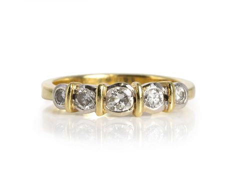 An 18ct two colour gold five stone diamond ring,  with graduated round brilliant cut diamonds, the combined weight estimated 