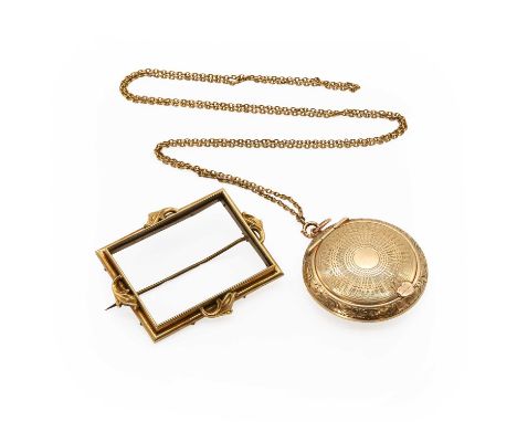 An Edwardian 9ct gold locket pendant and a brooch frame, the 9ct gold pendant locket with machine and hand engraving, circula