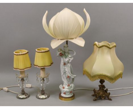 A modern Chinese porcelain figure of guanyin, mounted as a table lamp with lotus flower shade, 67cm high, an ornate gilt tabl