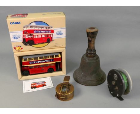 A T G Co Ltd London A266322 1940 Mk III brass cased compass, Air station 1942 hand bell, a Strike Right Featherflo fishing re