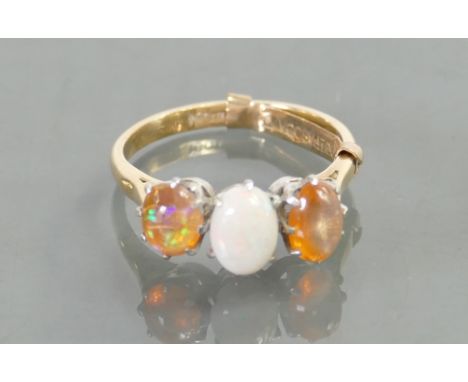 18ct &amp; platinum ring: Set with opals, size K, 3.1 grams.