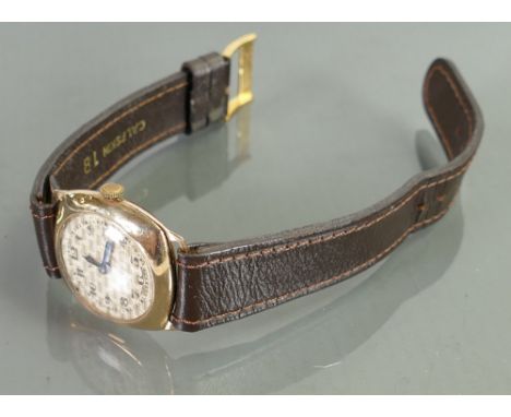 9ct gold vintage EKB gentlemans wristwatch: With leather strap.