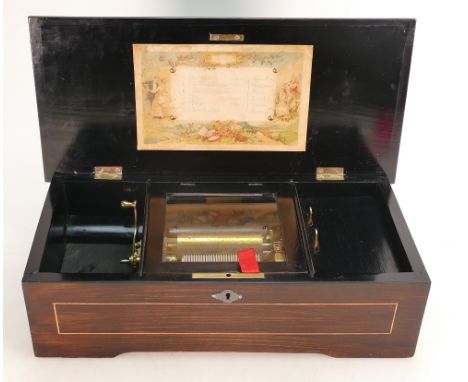 Swiss Musical box playing 6 Airs: In fully restored and working order, Rosewood, strung inlaid case measuring 40cm wide.